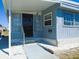 Charming single-story home featuring an inviting front entrance with secure screen door and well-maintained landscaping at 652 54Th S Ln # 153, Gulfport, FL 33707