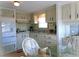 Functional kitchen area includes bright counters, cabinets, modern appliances, and a view towards the eating area at 652 54Th S Ln # 153, Gulfport, FL 33707
