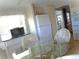 Efficient kitchen area with appliances, breakfast counter, glass table and chairs, plus lots of natural light at 652 54Th S Ln # 153, Gulfport, FL 33707