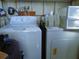 Functional laundry room with washer and dryer, providing convenience and efficiency at 652 54Th S Ln # 153, Gulfport, FL 33707
