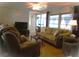 Relaxing living room with comfortable seating, lots of windows, ceiling fan, and a warm, inviting atmosphere at 652 54Th S Ln # 153, Gulfport, FL 33707