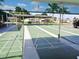 Exterior shot of the shuffleboard court and surrounding structures at 652 54Th S Ln # 153, Gulfport, FL 33707