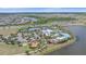 Aerial view of community amenities: clubhouse, tennis courts, playground, and resort-style pool at 7338 Milestone Dr, Apollo Beach, FL 33572