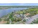 Aerial view shows a lake, community park, playground, and parking lot at 7338 Milestone Dr, Apollo Beach, FL 33572