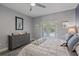 Bright main bedroom with ensuite bathroom, ceiling fan, and access to outdoor pool area at 7338 Milestone Dr, Apollo Beach, FL 33572