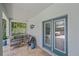 Screened patio with comfortable seating and tile flooring at 7338 Milestone Dr, Apollo Beach, FL 33572