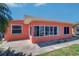Home's exterior featuring a large front yard and convenient driveway at 763 182Nd E Ave, Redington Shores, FL 33708