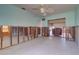 Open living area with ceiling fan and space for customization, ready for modern finishes and design at 763 182Nd E Ave, Redington Shores, FL 33708