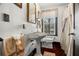 Well-lit bathroom with pedestal sink and classic fixtures at 806 Narcissus Ave, Clearwater Beach, FL 33767