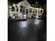 This house has a welcoming facade with neat landscaping, bright lighting, and a well-kept driveway at 806 Narcissus Ave, Clearwater Beach, FL 33767