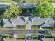 Aerial view of the home showcasing the roof, brick driveway, and surrounding greenery at 8244 Brentwood Rd, Seminole, FL 33777