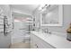 Bright bathroom with neutral tones and updated fixtures, including a stylish vanity mirror at 8244 Brentwood Rd, Seminole, FL 33777