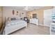 Comfortable bedroom with wood floors, a ceiling fan, and beach-themed decor to provide a relaxing retreat at 8244 Brentwood Rd, Seminole, FL 33777