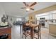 Well-lit dining area with ceiling fan that transitions to the kitchen, offering a seamless living experience at 8244 Brentwood Rd, Seminole, FL 33777