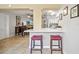 Bright kitchen with a breakfast bar and seating that opens to a spacious living area with tile floors at 8244 Brentwood Rd, Seminole, FL 33777