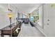 Bright living room boasts laminate flooring and large windows to allow for ample natural light at 8244 Brentwood Rd, Seminole, FL 33777
