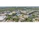 An aerial view of a waterfront neighborhood featuring canals, houses, and bridges over waterways at 8816 Memorial Hwy, Tampa, FL 33615