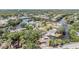 A scenic aerial view showcases a waterfront community with lush greenery and waterways at 8816 Memorial Hwy, Tampa, FL 33615