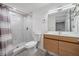 Renovated bathroom featuring walk-in shower and sleek vanity at 8816 Memorial Hwy, Tampa, FL 33615