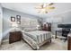 Bedroom featuring natural light, ceiling fan and tasteful décor with a desk setup for office use at 8816 Memorial Hwy, Tampa, FL 33615