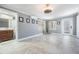 Neutral primary bedroom featuring tile floors, and an ensuite bathroom with natural light from the window at 8816 Memorial Hwy, Tampa, FL 33615