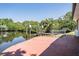 The backyard dock offers peaceful water views and ample space at 8816 Memorial Hwy, Tampa, FL 33615