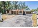 Charming single story home with attached garage, well maintained landscaping and a long driveway at 8816 Memorial Hwy, Tampa, FL 33615