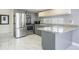 Bright kitchen featuring stone countertops and stainless appliances at 8816 Memorial Hwy, Tampa, FL 33615