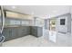 Renovated kitchen with stone countertops and stainless appliances at 8816 Memorial Hwy, Tampa, FL 33615