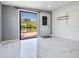 Living room with bright floors and view of backyard dock at 8816 Memorial Hwy, Tampa, FL 33615
