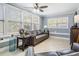 Comfortable living room with natural light, neutral paint, ceiling fan and leather sofas at 8816 Memorial Hwy, Tampa, FL 33615