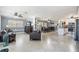 Expansive open living area showcasing tiled floors and lots of natural light throughout the dining and kitchen area at 8816 Memorial Hwy, Tampa, FL 33615