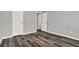 The bedroom features wood floors, light gray walls, white doors and baseboards, and recessed lighting at 9603 Sunnyoak Dr, Riverview, FL 33569