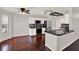 Bright, updated kitchen featuring white cabinets, black countertops, and stainless steel appliances at 9603 Sunnyoak Dr, Riverview, FL 33569