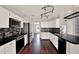 Bright, updated kitchen featuring white cabinets, black countertops, and stainless steel appliances at 9603 Sunnyoak Dr, Riverview, FL 33569