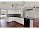 Well-lit kitchen with granite counters, stainless steel appliances, and breakfast bar at 9603 Sunnyoak Dr, Riverview, FL 33569