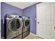 Laundry room featuring side-by-side washer and dryer set with tile floor at 9603 Sunnyoak Dr, Riverview, FL 33569