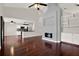 Spacious living room with hardwood floors, modern fireplace, and open floor plan with high ceilings at 9603 Sunnyoak Dr, Riverview, FL 33569
