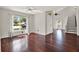 Bright living room with hardwood floors, large windows, and a staircase leading to the second floor at 9603 Sunnyoak Dr, Riverview, FL 33569