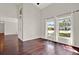 Bright living room with hardwood floors, high ceilings, and large windows offering natural light at 9603 Sunnyoak Dr, Riverview, FL 33569