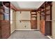Custom walk-in closet with built-in shelving and drawers for optimal organization at 9603 Sunnyoak Dr, Riverview, FL 33569