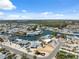 An aerial shot of waterfront homes situated on canals, offering stunning views of the surrounding neighborhood and lush scenery at 9920 Spoonbill E Rd, Bradenton, FL 34209