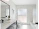 Modern bathroom with sleek vanity, elegant marble, and bright lighting at 9920 Spoonbill E Rd, Bradenton, FL 34209