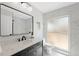 Modern bathroom with sleek vanity, elegant marble, and bright lighting at 9920 Spoonbill E Rd, Bradenton, FL 34209