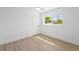 Clean bedroom with hard wood floors, ceiling fan and window view at 9920 Spoonbill E Rd, Bradenton, FL 34209