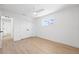 Clean bedroom with hard wood floors, ceiling fan and large closet at 9920 Spoonbill E Rd, Bradenton, FL 34209