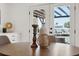 Dining room features a wooden table, modern decor, and views of the canal at 9920 Spoonbill E Rd, Bradenton, FL 34209