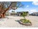 Beautiful home exterior with a pergola, tidy landscaping, and a welcoming pathway at 9920 Spoonbill E Rd, Bradenton, FL 34209