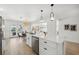 Open kitchen with quartz countertops, stainless steel appliances, and ample cabinet space at 9920 Spoonbill E Rd, Bradenton, FL 34209