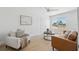 Comfortable living room area with neutral colors and a view to the outdoors at 9920 Spoonbill E Rd, Bradenton, FL 34209